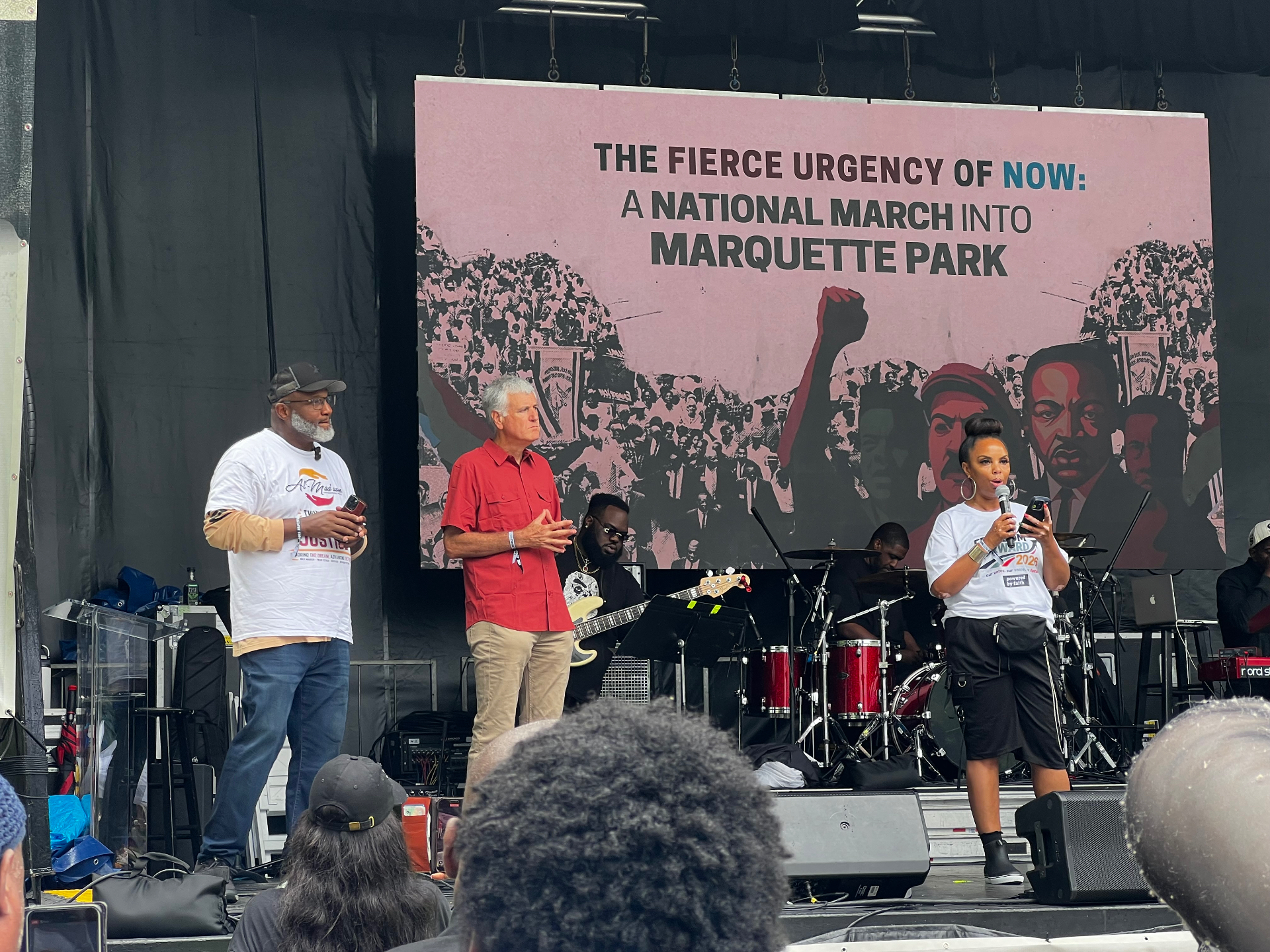 Al Maa'uun leadership on stage at the Marquette Park march with speakers addressing the crowd